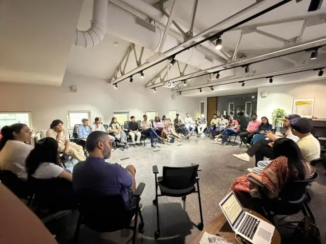 Guests in conversation at U-CAN City Mixer, Artha Global, Mumbai, April 24, 2026